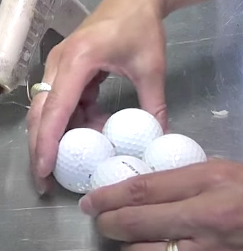 Glue four white golf balls together