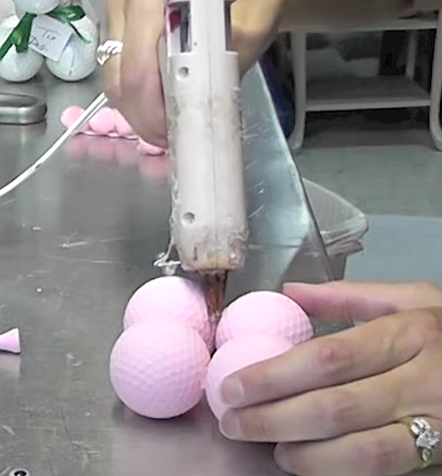 Glue pink golf balls together