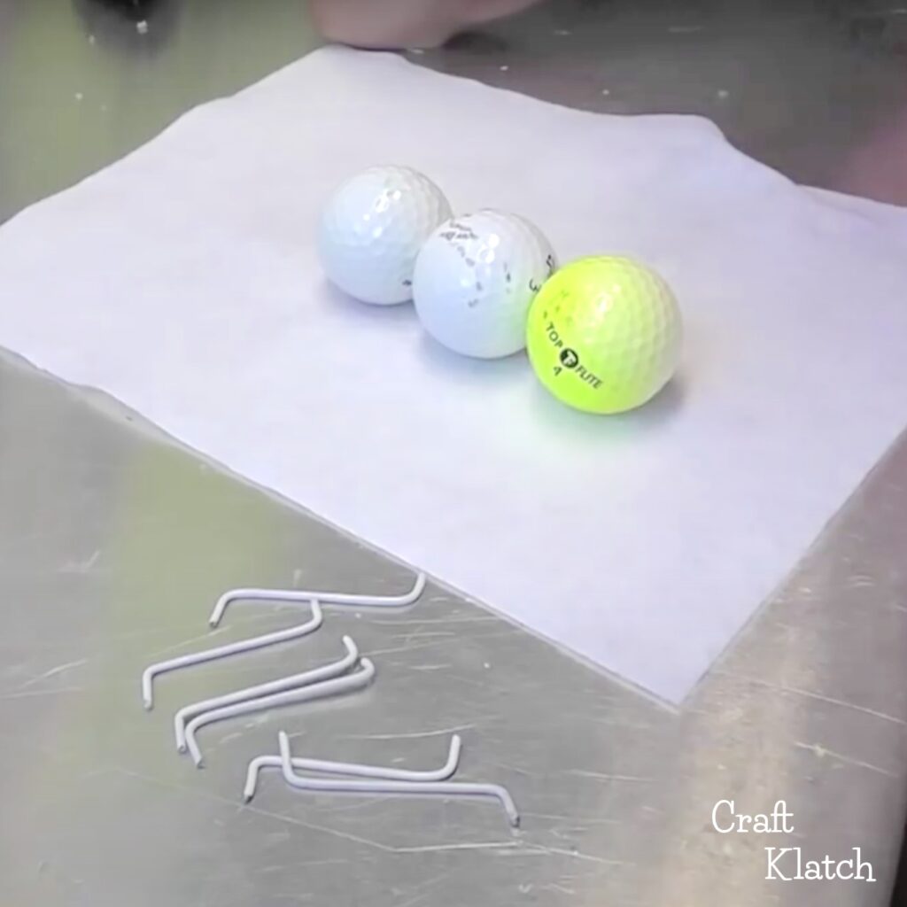 Golf balls and wire legs for giant ants craft
