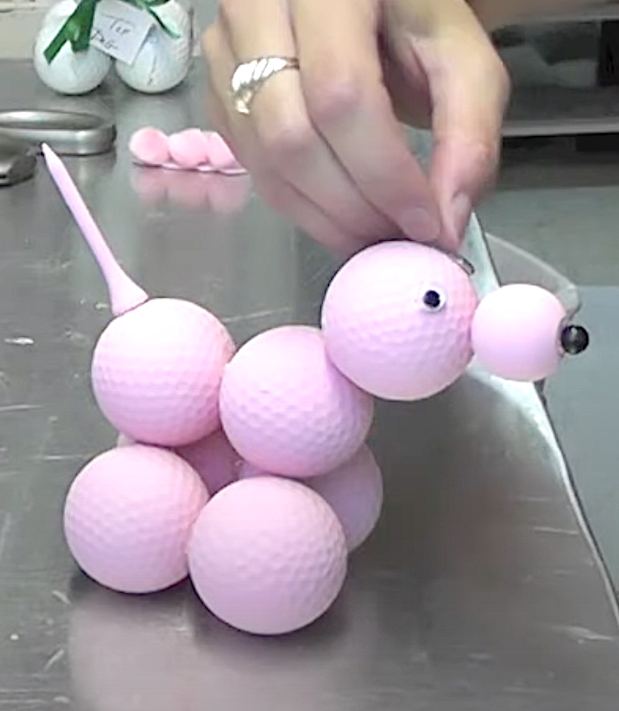Glue on google eyes to the pink poodle