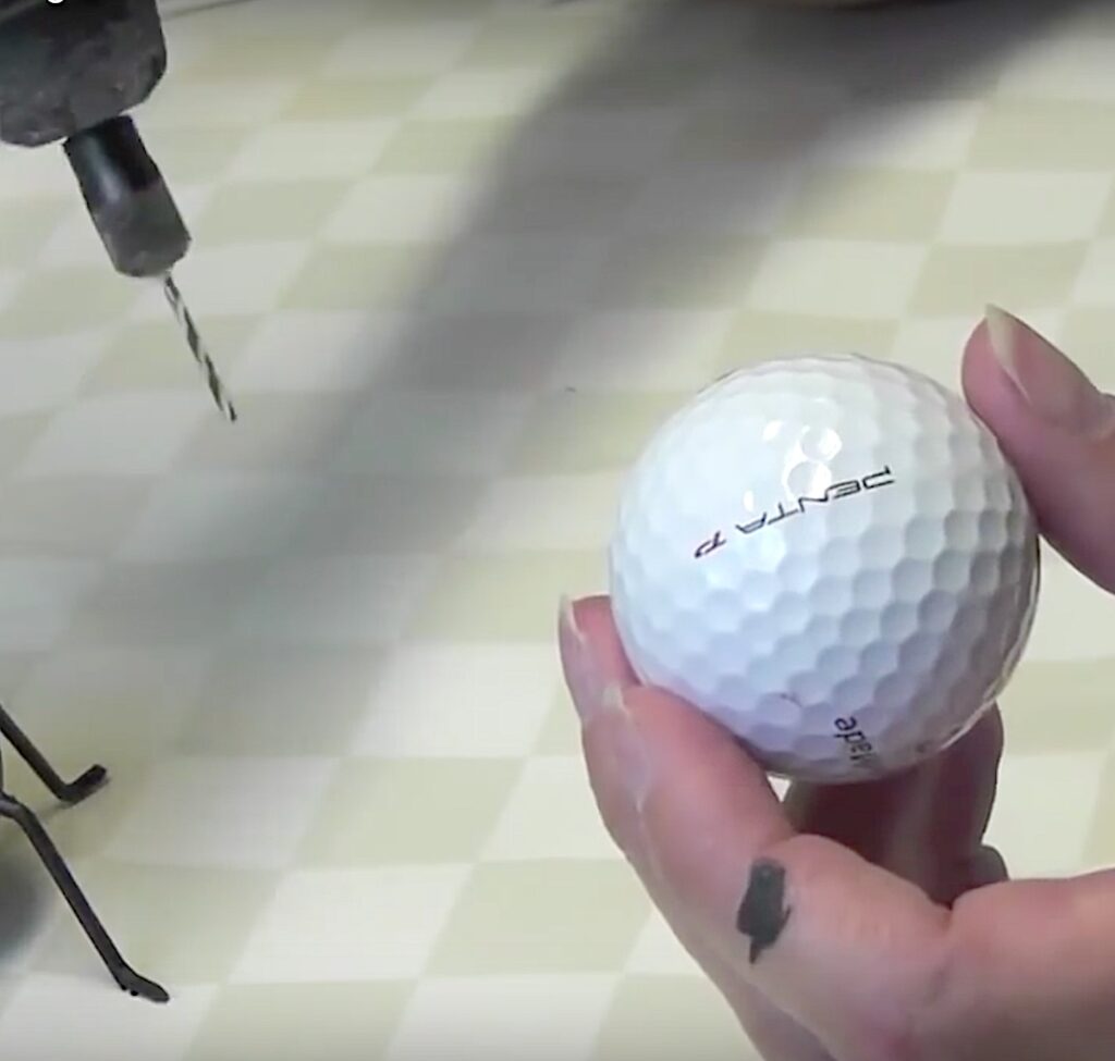 Use rotary tool or drill to drill holes into golf ball for the legs