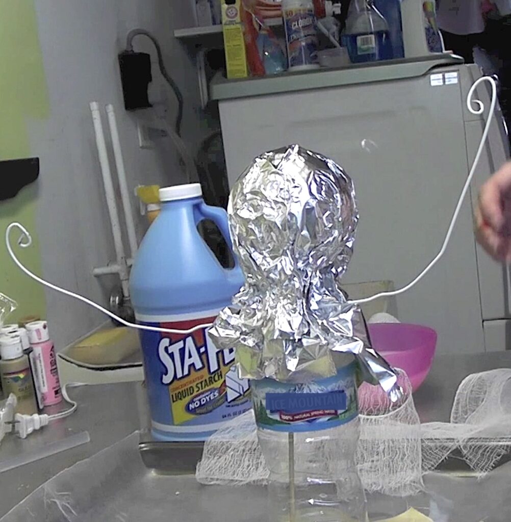 Wrap the styrofoam ball with aluminum foil