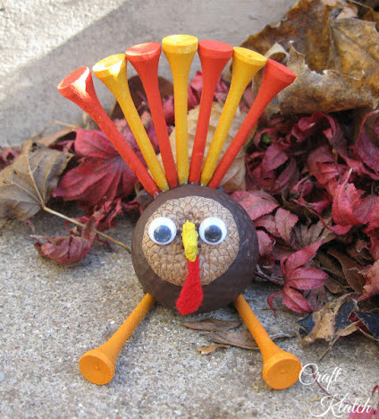 how to make a golf ball turkey finished project sitting by fall leaves