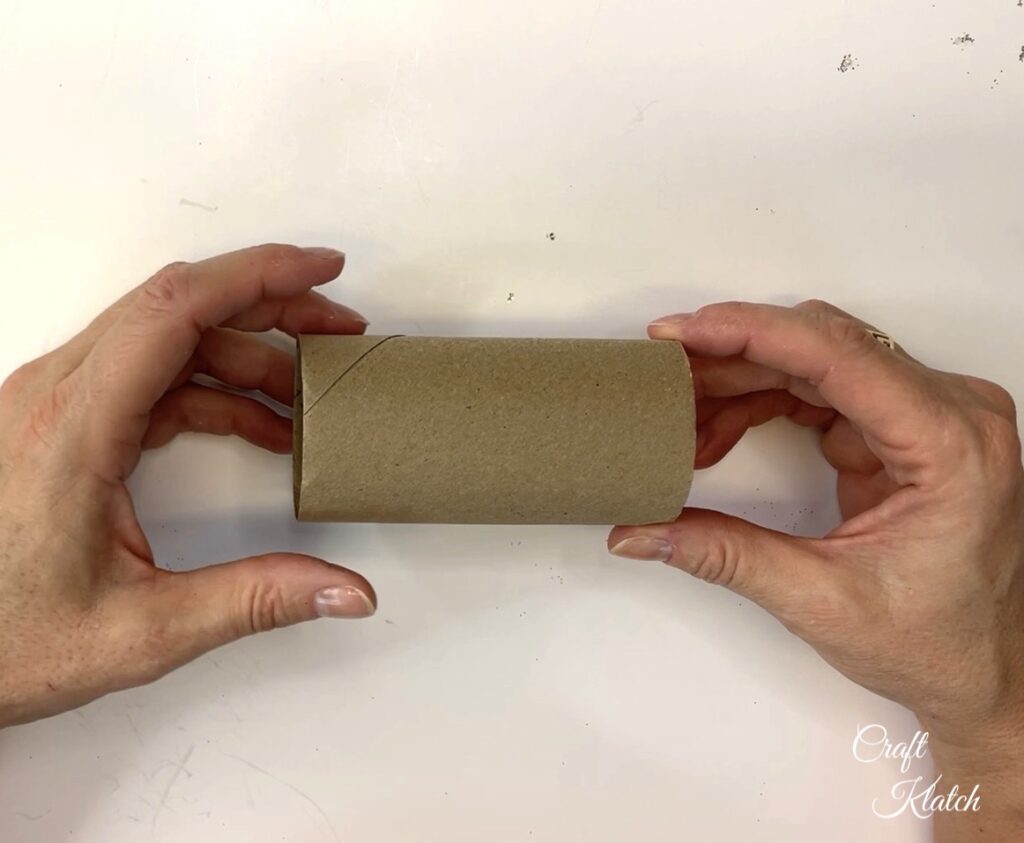 Holding empty toilet paper roll