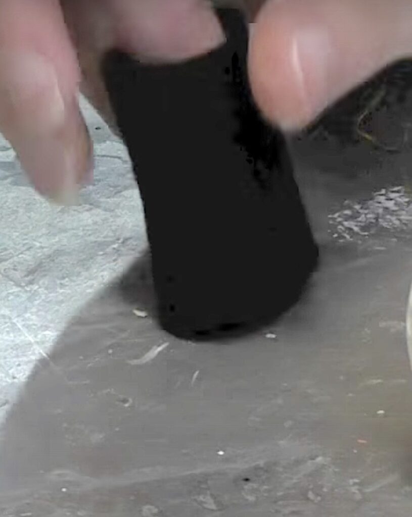 cut a strip of black felt and glue it into a tube
