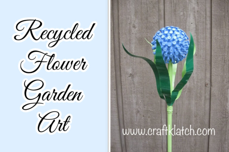 Recycled flower garden art blue flower and green stem and leaves