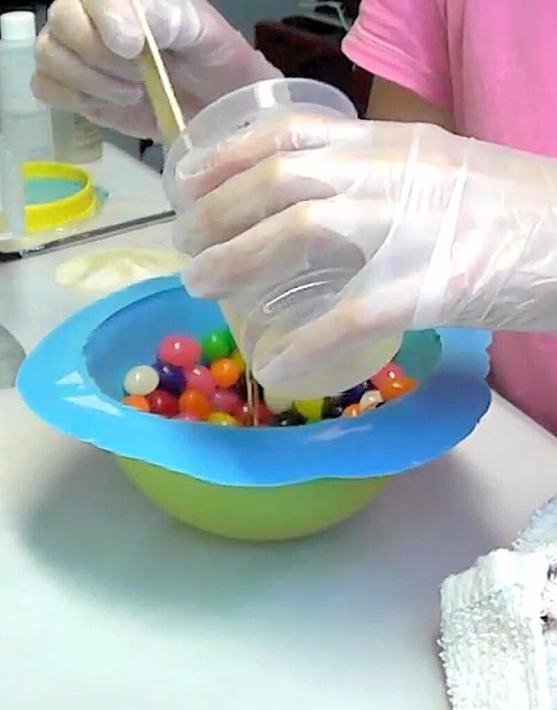 Pouring resin into the jellybean bowl for the Easter candy bowl