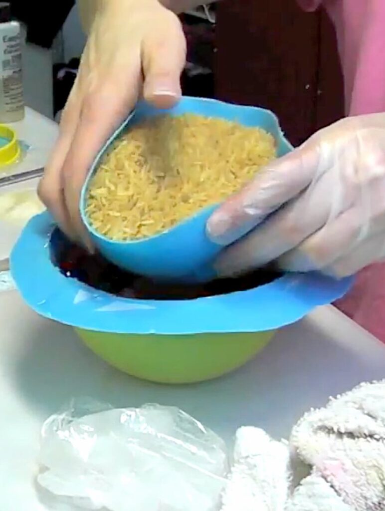 Putting a rice filled silicone inner bowl onto the jelly beans