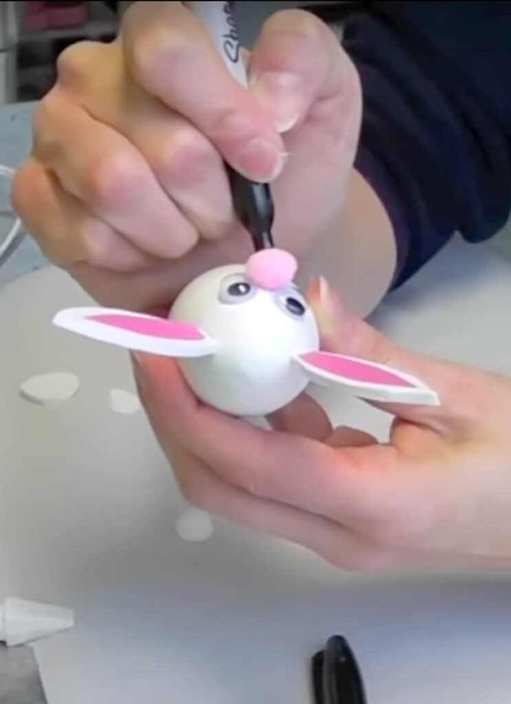 Use a marker to draw the mouth on the Easter Bunny