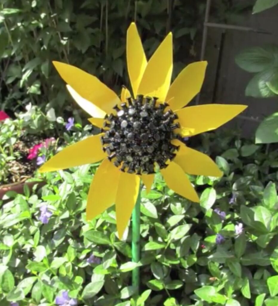 Recycled sunflower craft in garden