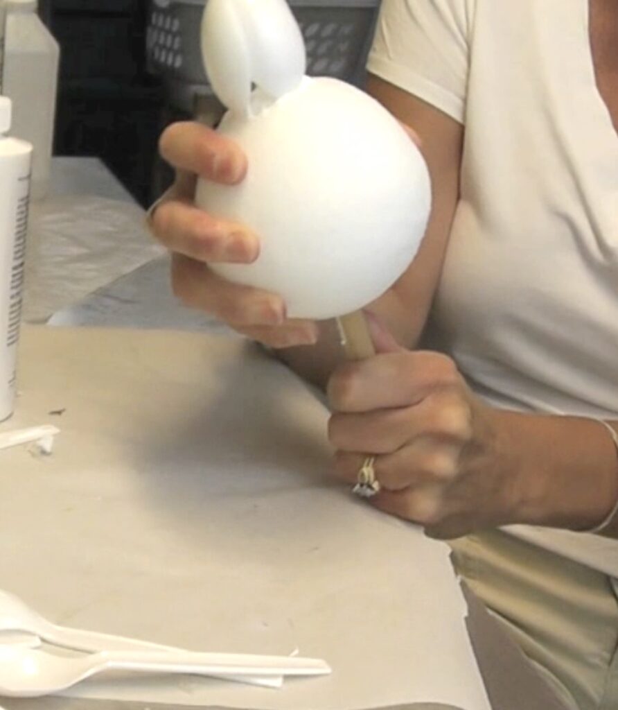 Insert wooden dowel rod into to bottom of the styrofoam ball