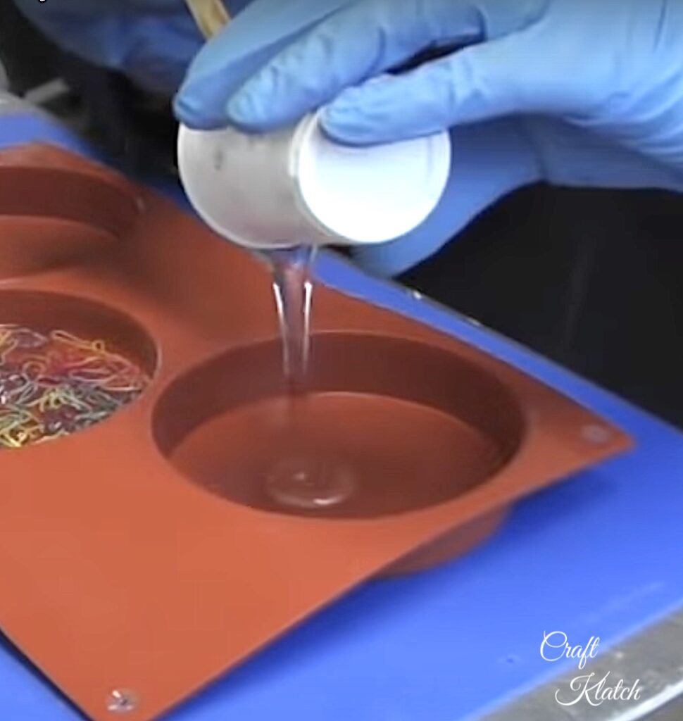 Pouring resin into coaster mold for back to school pencil coaster