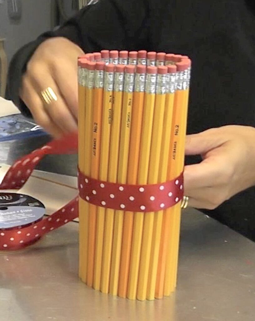 Tie red ribbon around the pencil vase
