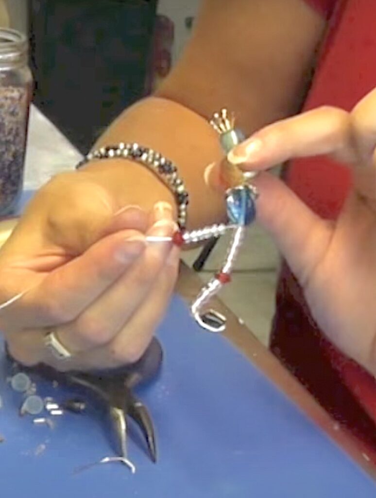 Bend wire to attach the beads for the feet