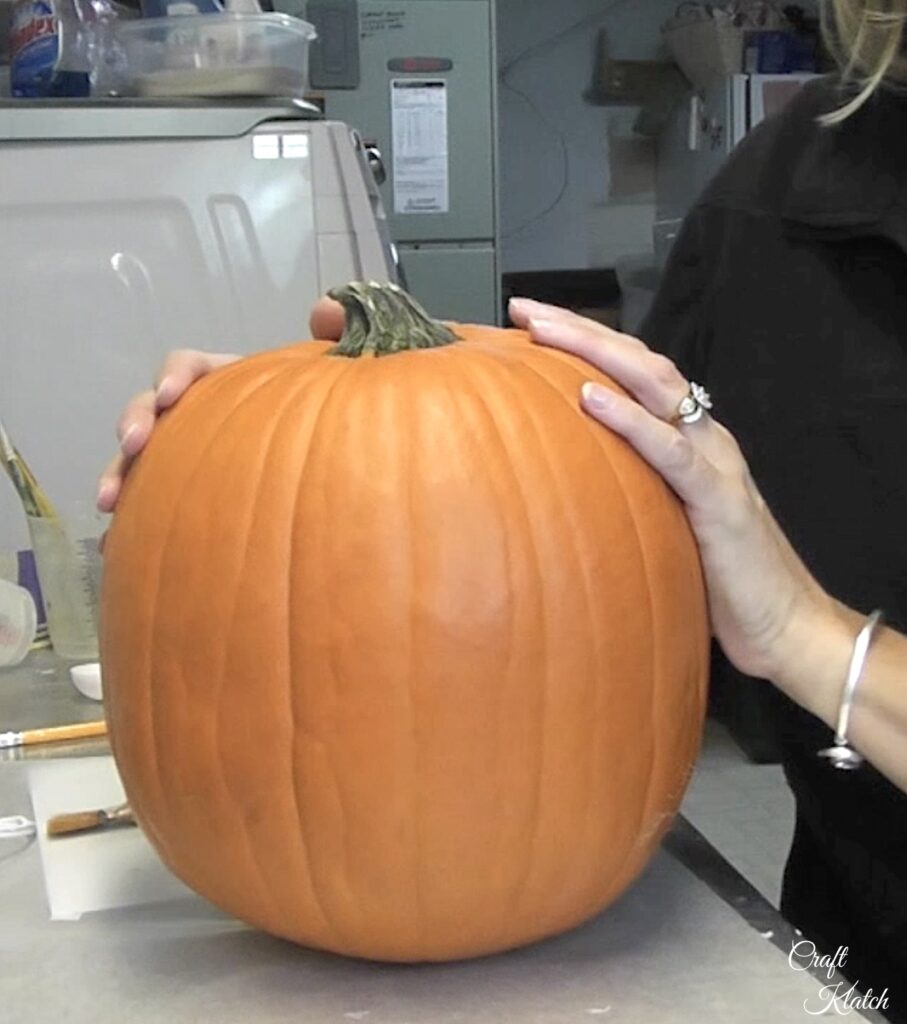 Orange pumpkin on craft table ready to be painted copy