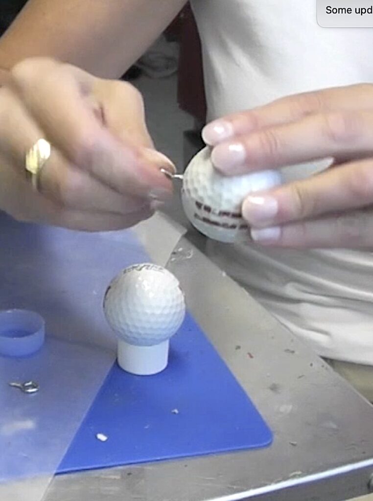 Screw eye screw into the golf ball