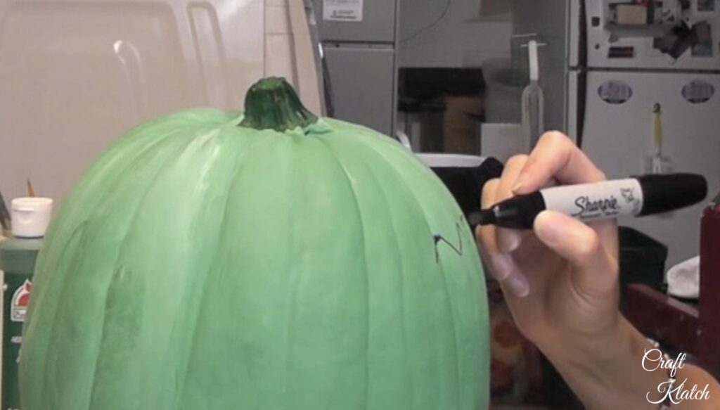 Use Sharpie to outline the pumpkin hairline