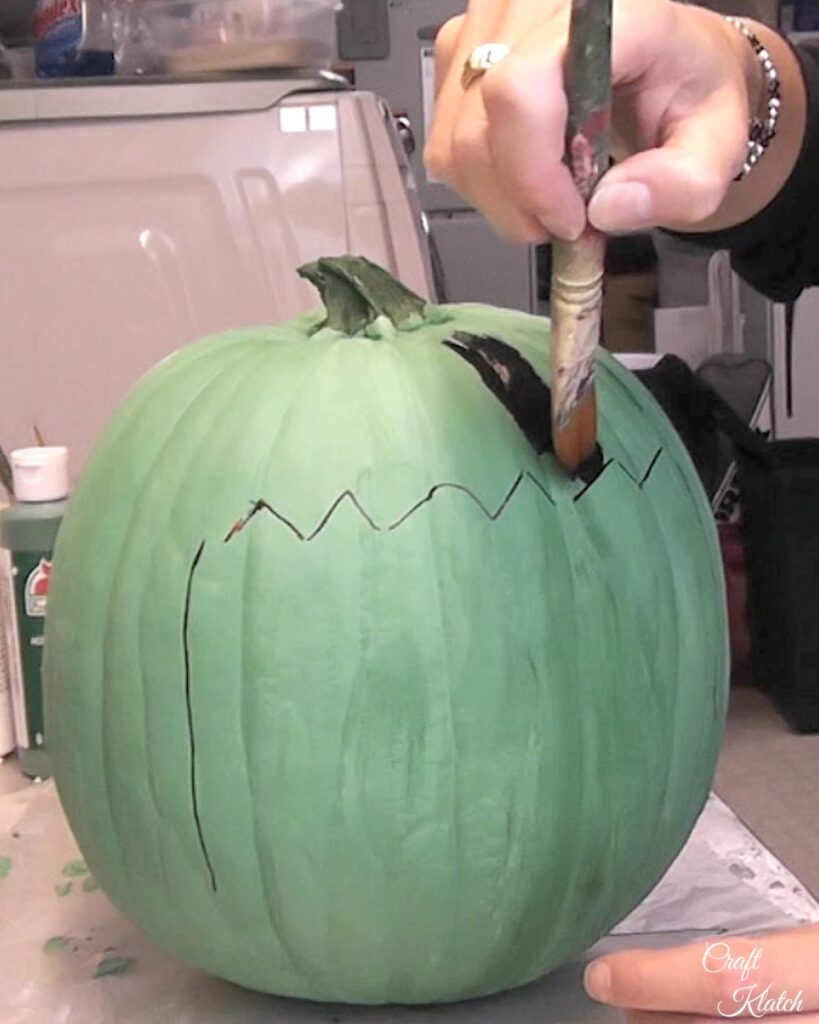 Pumpkin decorating without carving. Paint in Frankenstein pumpkin hairline with black paint