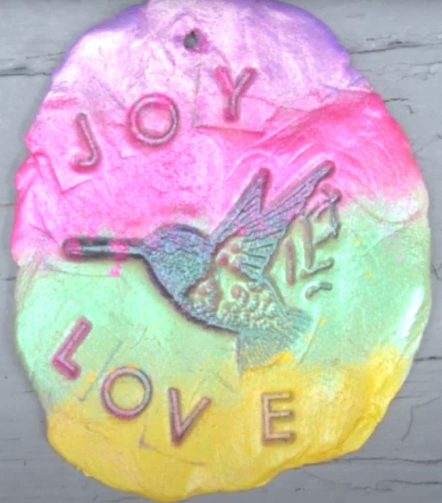 Finished back side of the DIY clay jewelry image transfer to clay