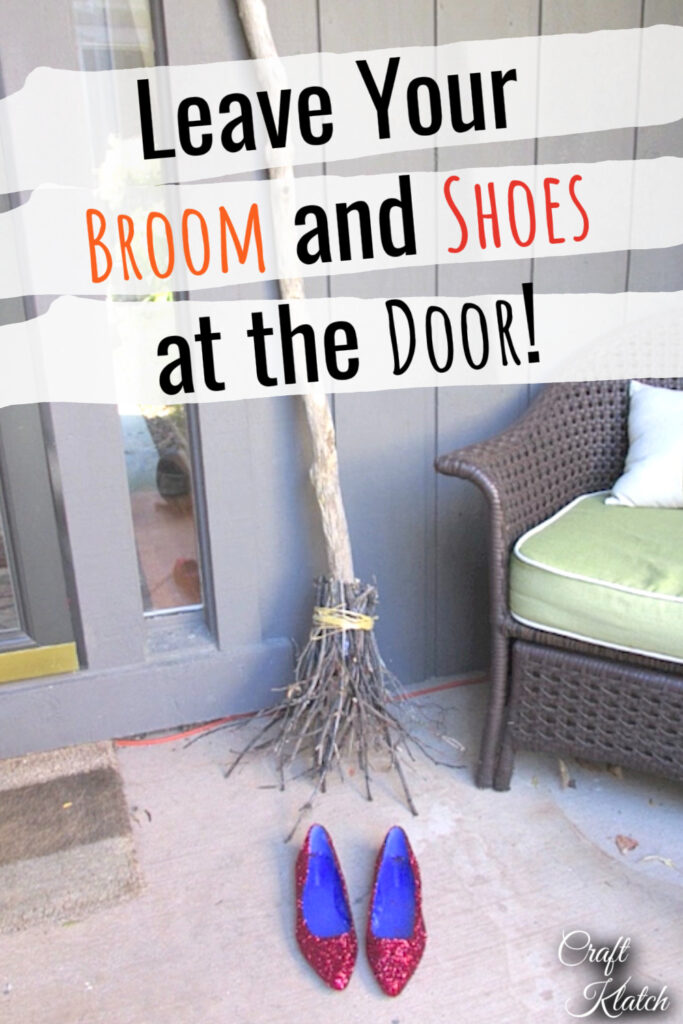 Witch's broom leaning at door with red slippers