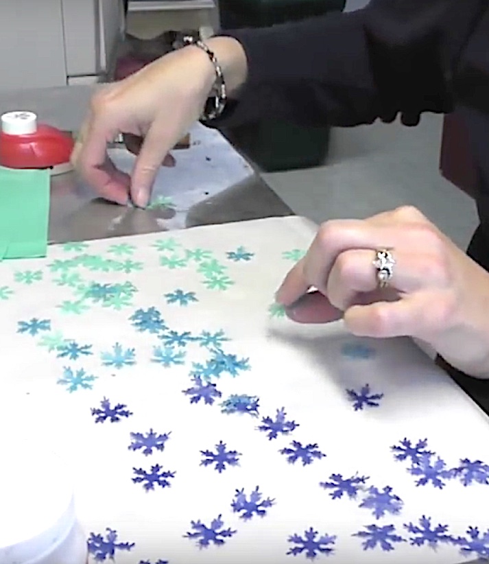 Punch a bunch of snowflakes out of blue tissue paper