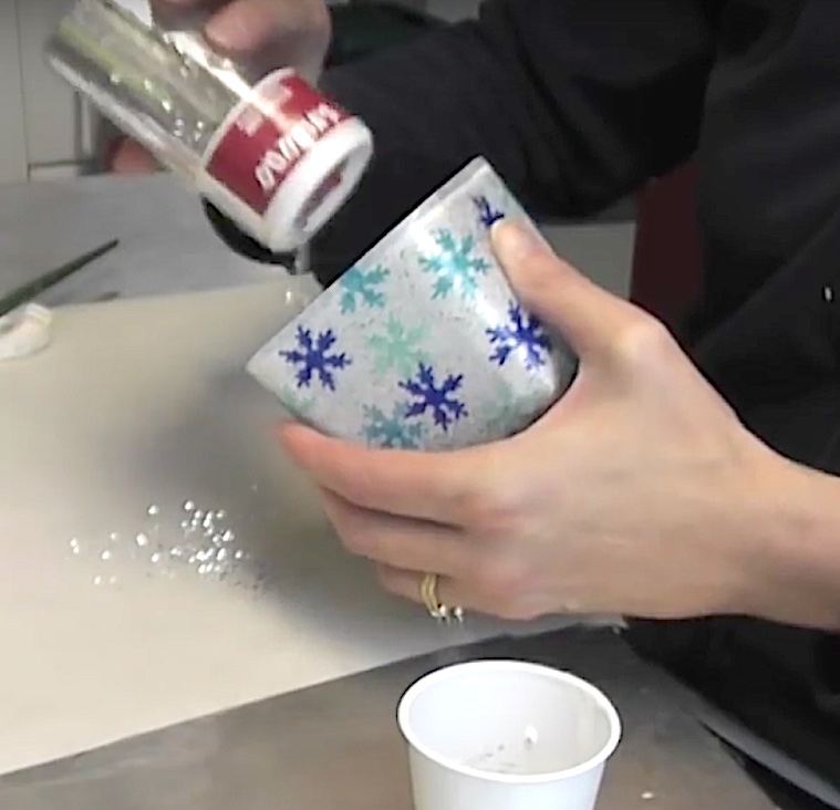 Pour glitter into the mod podge filled votive