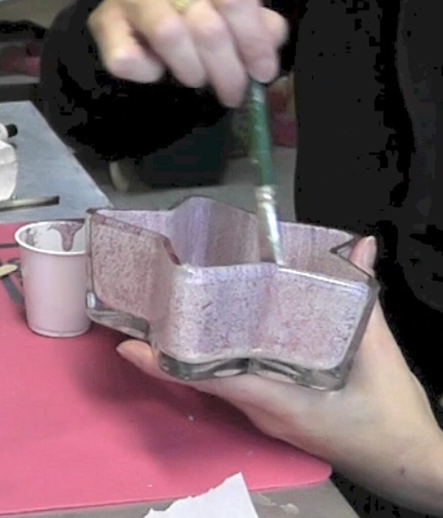 Brush a mix of Mod Podge and fine glitter onto the inside of the candy dish