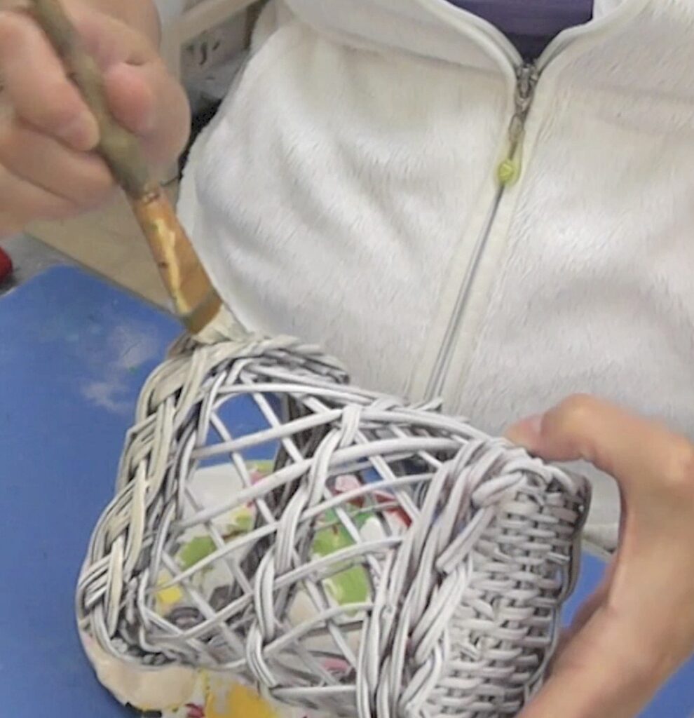 Lightly paint the basket with a mix of parchment and medium gray paint to give it a washed out look