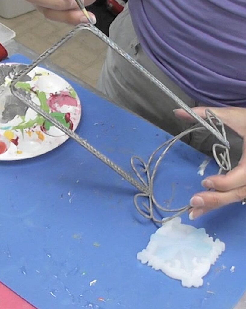 Paint a blue accent on the basket handle