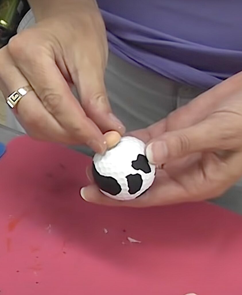 Glue wood cap to the golf ball