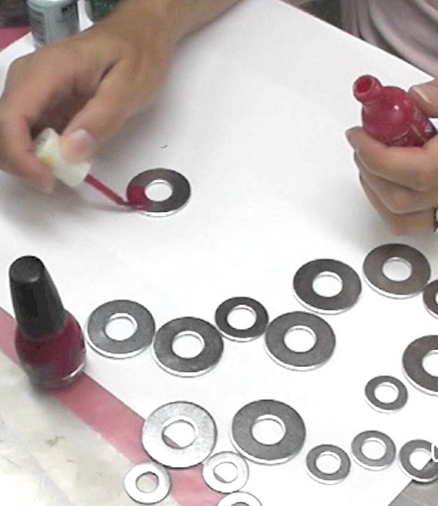 Paint metal washers with nail polish for washer necklaces