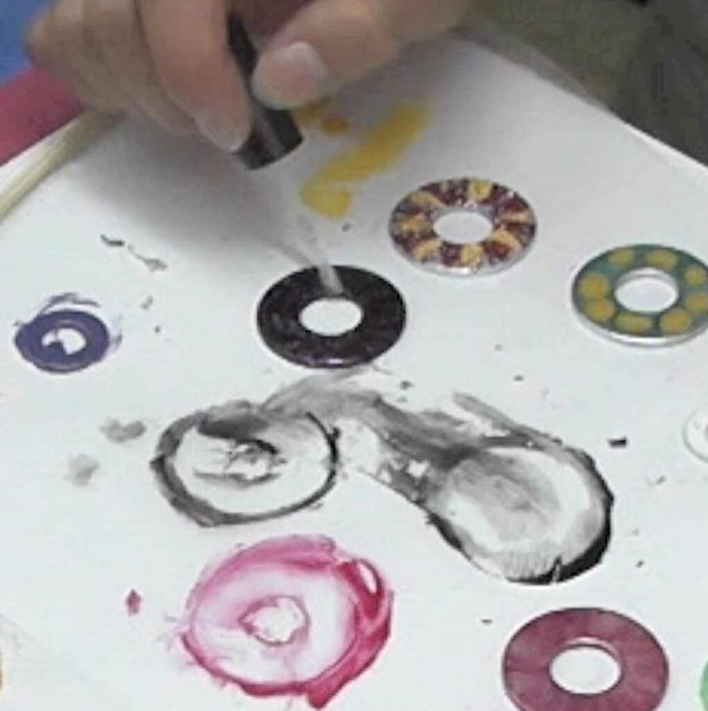Applying clear top topcoat to nail polish washer necklaces