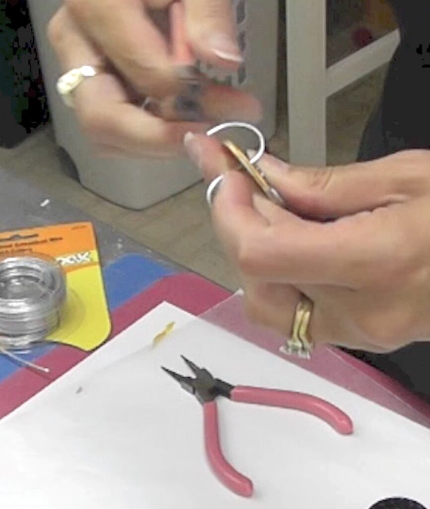 Bending wire to create a hook for nail polish washer necklaces