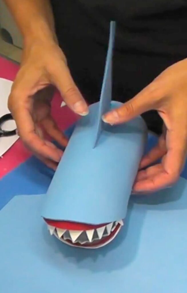 Adding the fin to the shark pencil holder craft