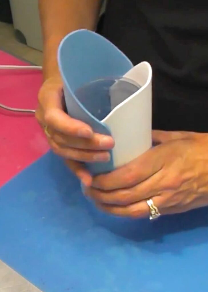 attaching the shark parts to the shark pencil holder