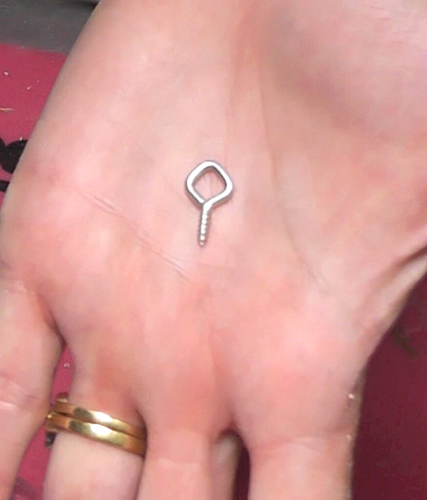 Eye screw in hand