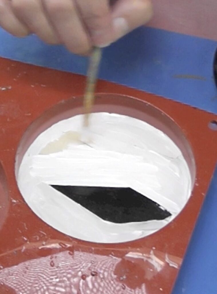 Paint the masking tape on the Halloween coaster