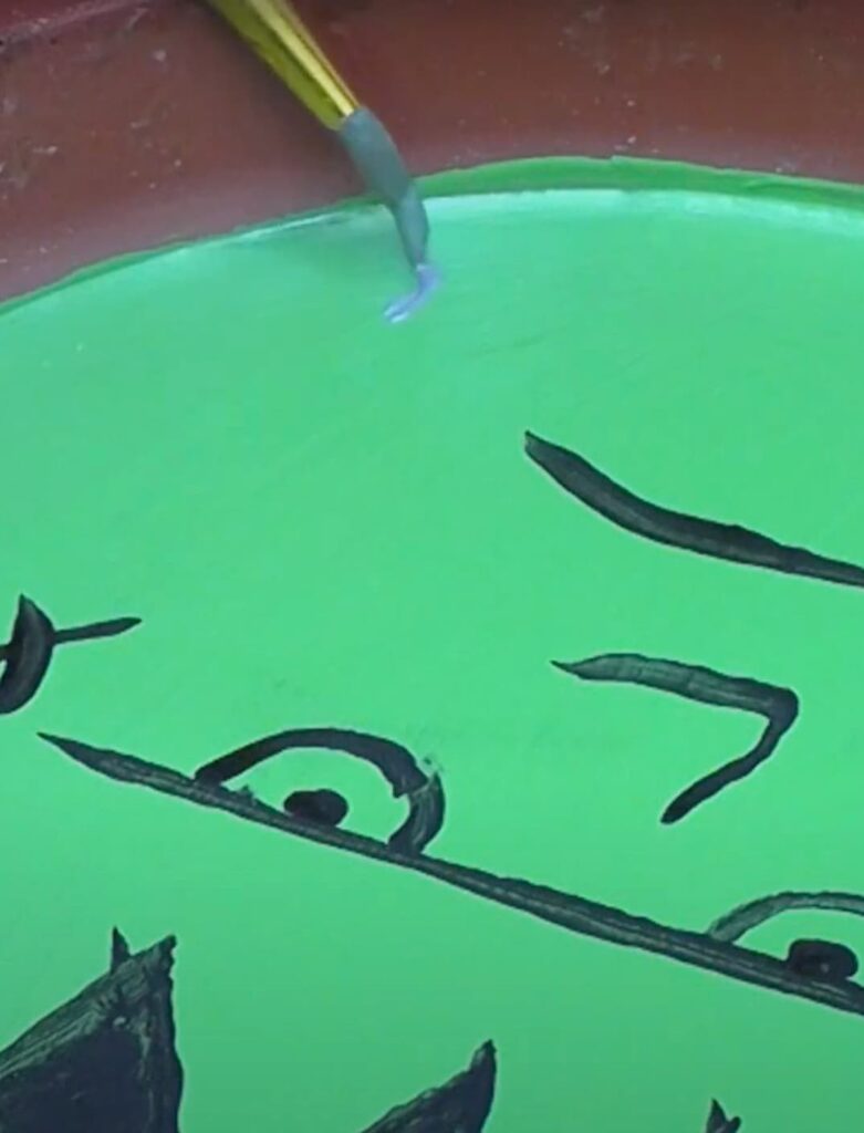 Painting the details on the Frankenstein art coaster