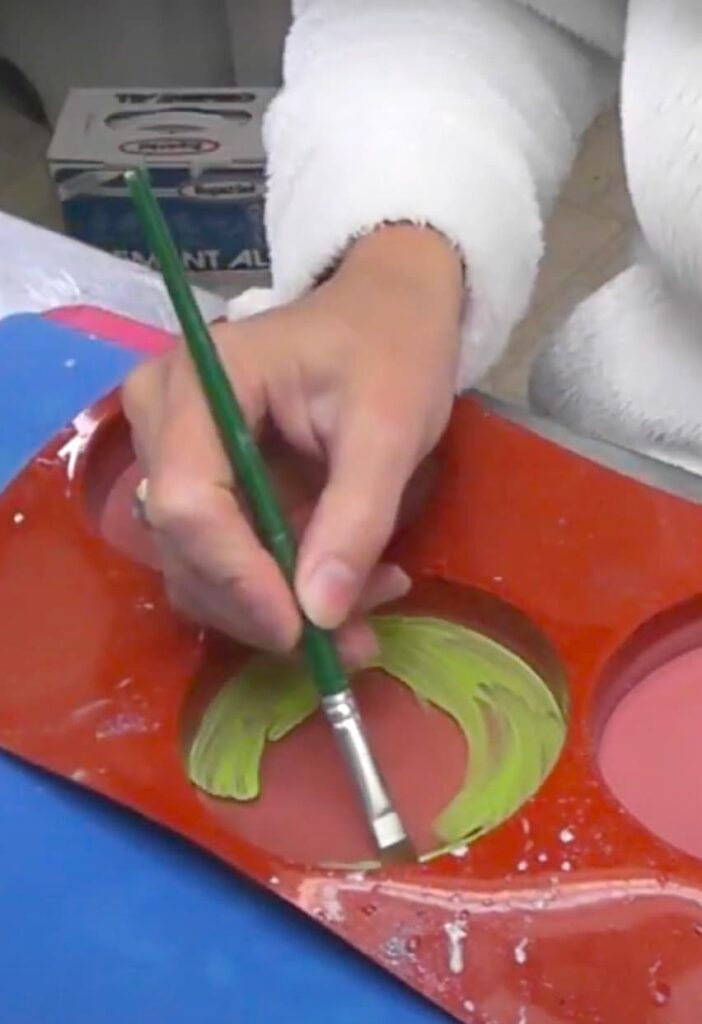 Painting the resin coaster green for the Frankenstein art coaster