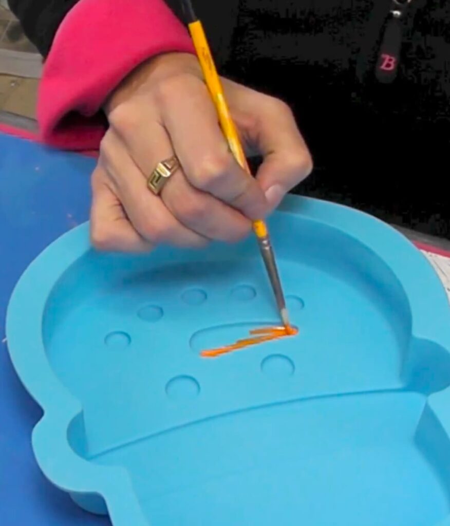 Painting the silicone snowman decoration mold orange