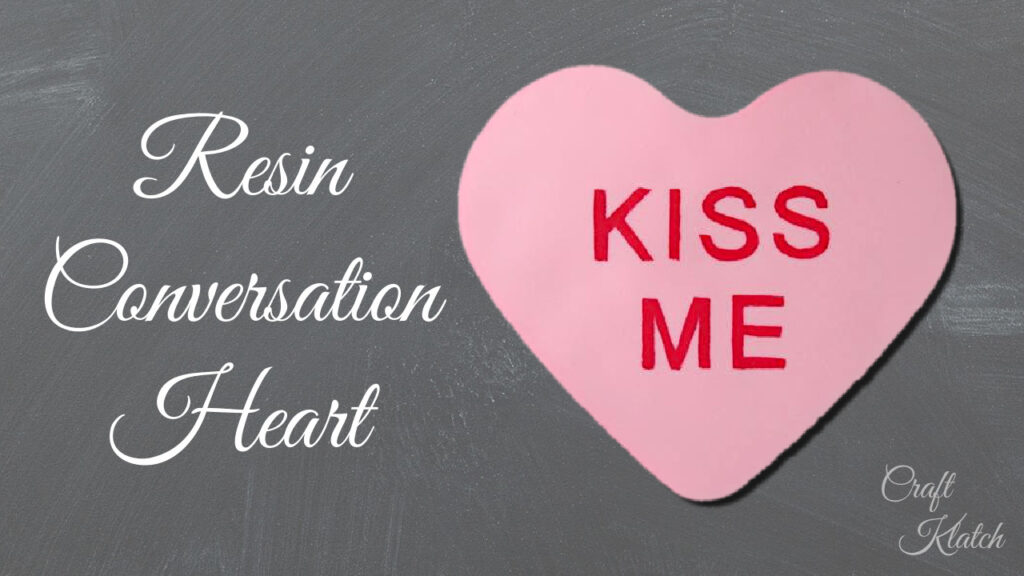 Pink resin Kiss Me conversation heart