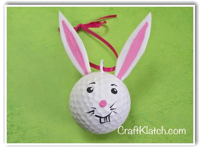 Golf ball bunny with red ribbon