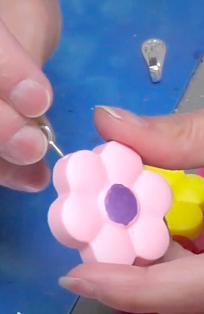 gluing a bezel onto a resin pink spring flower