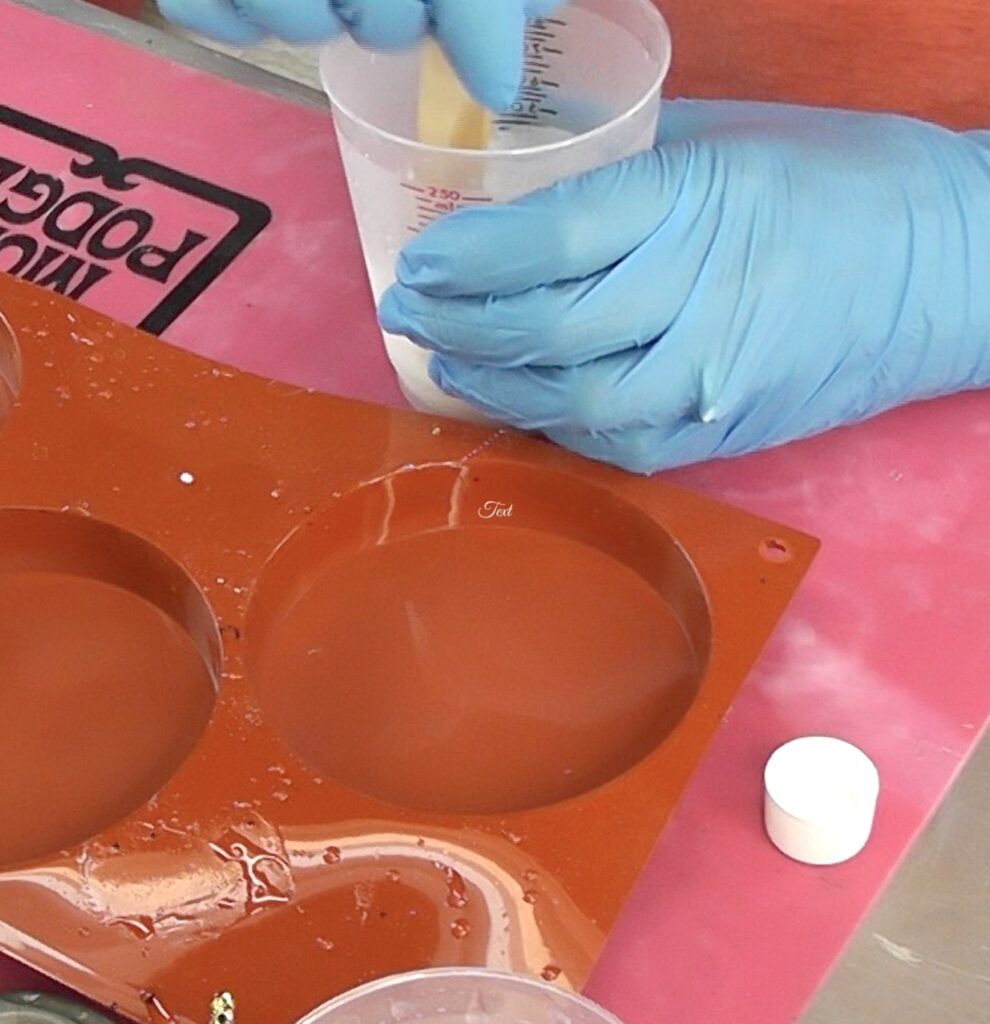 Mix resin with blue gloves and red silicone coaster mold