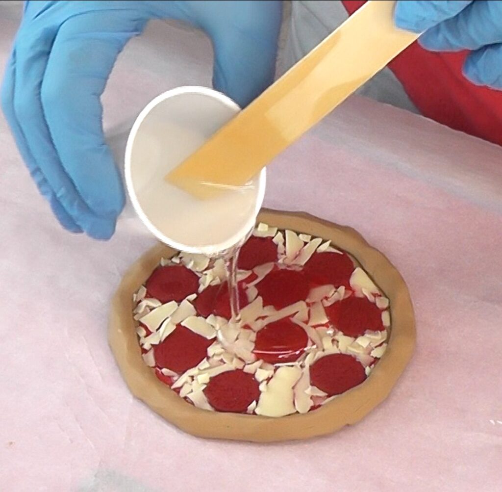 Pour resin over the clay DIY pizza craft