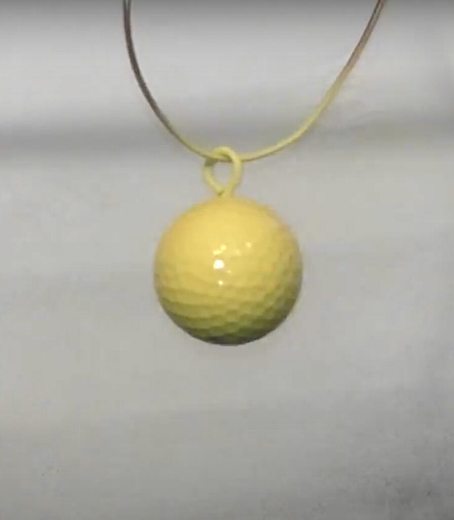 suspend golf ball and spray paint it yellow