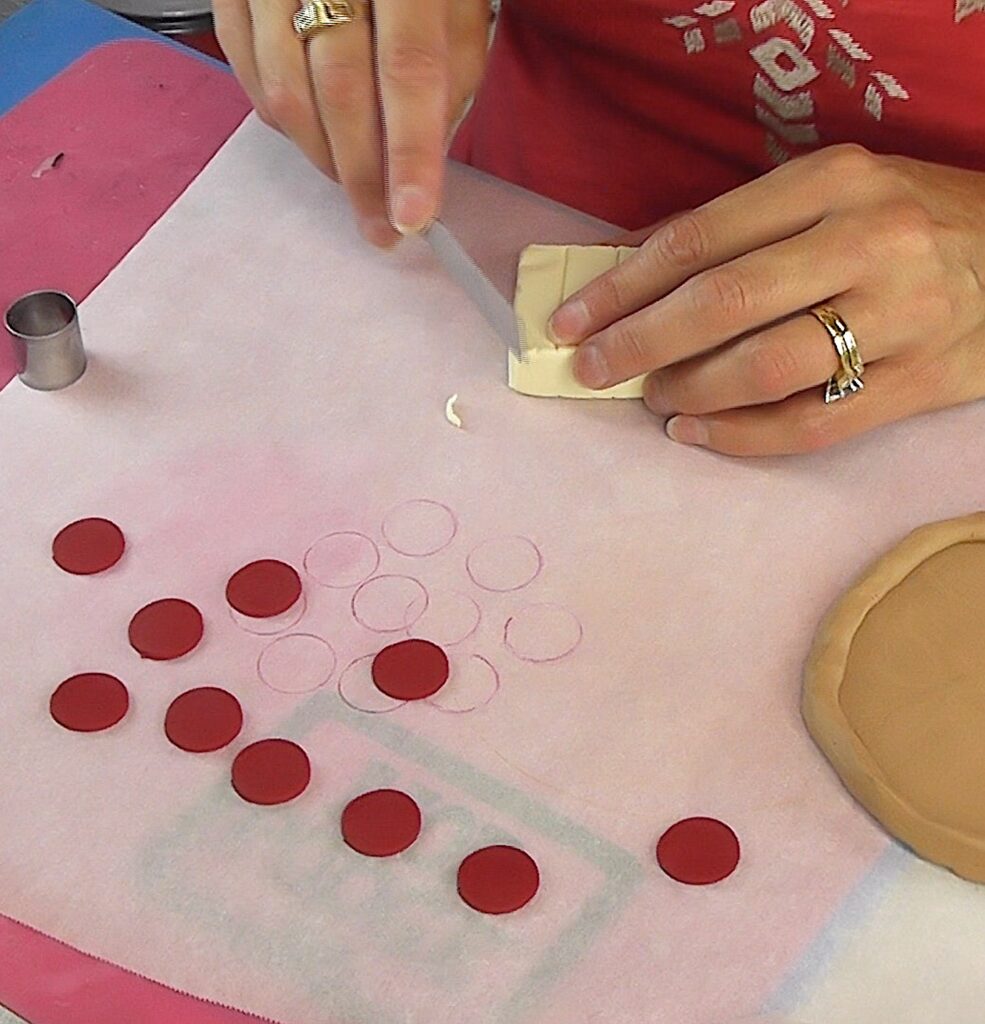 Use a craft blade to shave pieces of clay off of the glow in the dark clay for cheese