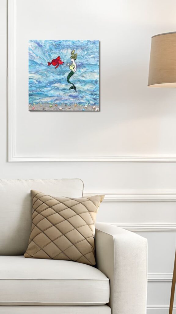 Mermaid mixed media art hanging on wall
