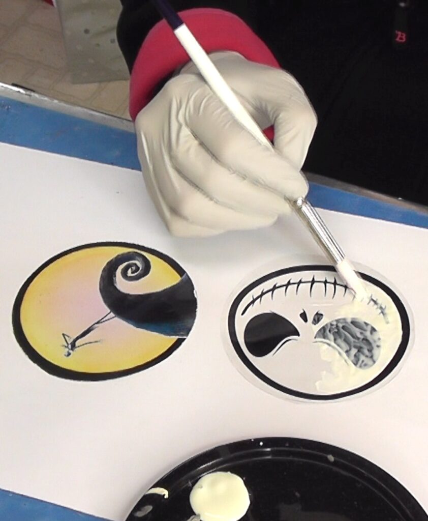 Paint glow in the dark paint on the back of the Nightmare Before Christmas images