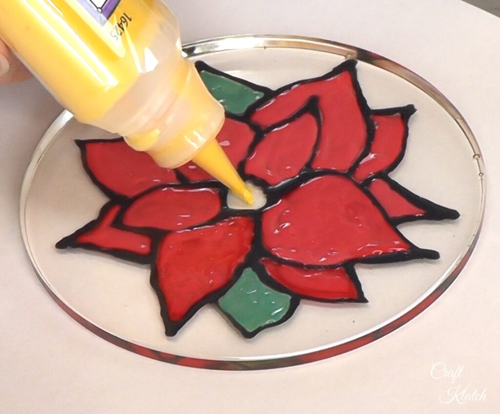 Paint in poinsettia with glass paint